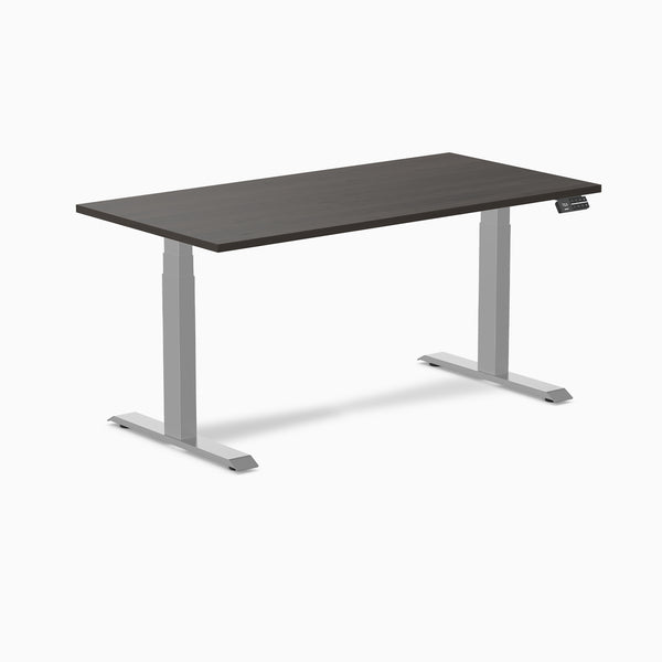 Dark laminate Desky Dual sit-stand desk with silver frame and digital control panel.