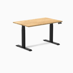 Desky Dual 48x30 inch White Oak hardwood sit-stand desk with matte black legs and control panel.