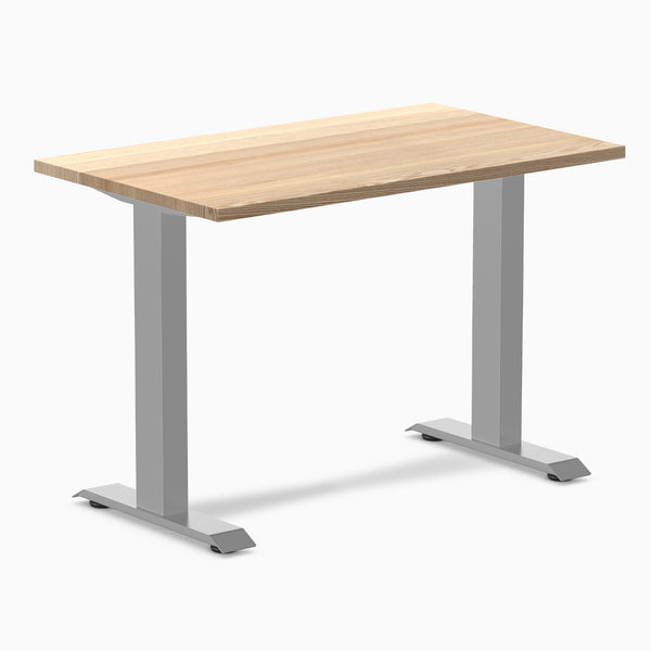 Desky Zero Mini hardwood desk with a light White Ash top and gray steel frame.