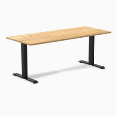 Desky Zero fixed-height office desk with a White Oak hardwood top and matte black steel frame.